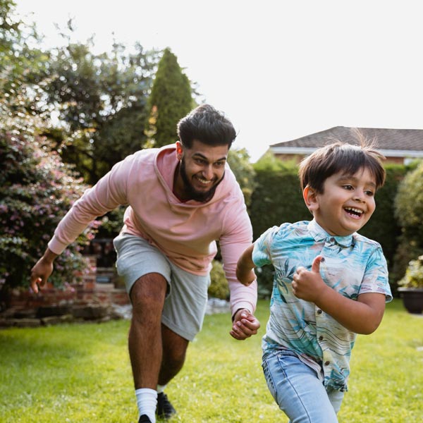 family running in backyard
